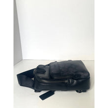 Load image into Gallery viewer, Black leather bag with a strap on a white background