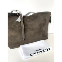 Load image into Gallery viewer, Brown suede handbag with a white pouch featuring 'Coach' logo on a light background