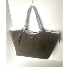 Load image into Gallery viewer, Gray handbag with a white interior on a light gray background