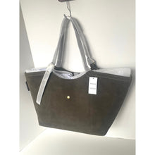 Load image into Gallery viewer, Gray handbag with a visible brand tag on a white background