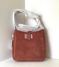 Load image into Gallery viewer, Brown suede handbag with white strap on a light gray background