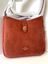 Load image into Gallery viewer, Brown Coach handbag with gold clasp on a white background