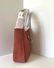 Load image into Gallery viewer, Brown tote bag with a white strap on a light gray background