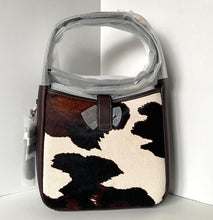 Load image into Gallery viewer, Handbag with cow print pattern on a white background