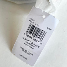 Load image into Gallery viewer, Clothing tag with barcode and text on a white background