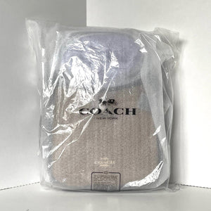 Coach backpack in clear plastic packaging on a white background