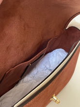 Load image into Gallery viewer, Brown leather handbag with gold clasp on a white background