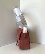 Load image into Gallery viewer, Brown handbag on a white surface with a neutral background