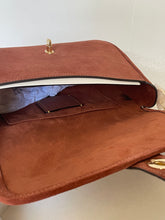 Load image into Gallery viewer, Brown leather handbag with gold hardware on a light background