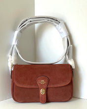 Load image into Gallery viewer, Brown handbag with a white strap on a light background