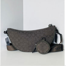 Load image into Gallery viewer, Brown handbag with circular pouch on a white background