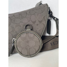 Load image into Gallery viewer, Gray handbag with circular clasp on a light gray background