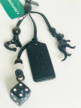 Load image into Gallery viewer, Black leather keychain with dice and clasp on a white background