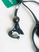 Load image into Gallery viewer, Close-up of a black leather cord with a metal clasp on a white background