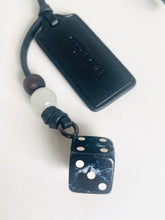 Load image into Gallery viewer, Black dice charm with white dots on a white background