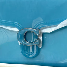 Load image into Gallery viewer, Close-up of a blue plastic container with a metal clip on a blue background