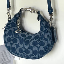 Load image into Gallery viewer, Blue patterned handbag with silver hardware on a white background