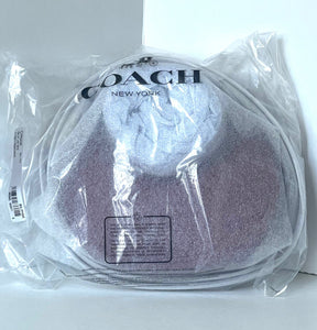 Coach New York product in clear packaging on a white background