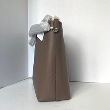 Load image into Gallery viewer, Brown leather handbag with a bow on a white background