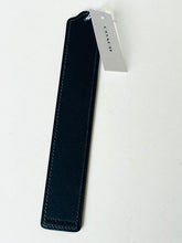 Load image into Gallery viewer, A Coach leather accessory tag or keychain in dark navy blue with a white paper tag attached, photographed on a light off-white background.