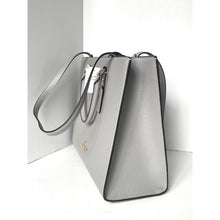 Load image into Gallery viewer, Silver handbag with a visible brand logo on a white background