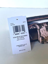 Load image into Gallery viewer, A white retail hangtag with a barcode and product text is attached to a small zip wallet with a pink, black, and beige snakeskin pattern, photographed on a light surface.