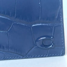 Load image into Gallery viewer, Blue textured wallet with a brand logo on a white background