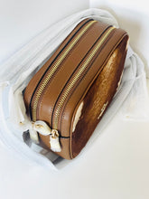 Load image into Gallery viewer, Brown leather bag with gold zippers on a white background