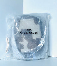 Load image into Gallery viewer, Coach shoe in clear packaging on a light blue background