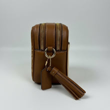 Load image into Gallery viewer, Brown leather crossbody bag with zipper details on a white fur background