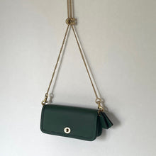 Load image into Gallery viewer, Green handbag with a gold chain on a light gray background