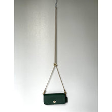 Load image into Gallery viewer, Green handbag with a gold chain strap on a light gray background