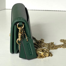 Load image into Gallery viewer, Green Coach handbag with gold chain and tag on a white background
