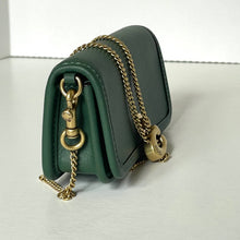 Load image into Gallery viewer, Green leather handbag with gold chain on a white background