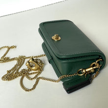 Load image into Gallery viewer, Green leather handbag with gold chain on a white background