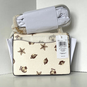 Baby blanket with starfish and shell pattern on a white background