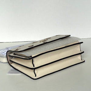 Stack of books with decorative covers on a white background