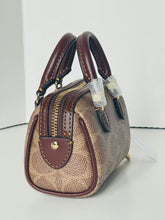 Load image into Gallery viewer, Brown and beige handbag with gold zipper on a white background