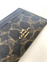 Load image into Gallery viewer, Blue wallet with gold pattern and Coach logo on a white background