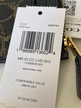 Load image into Gallery viewer, Product tag with barcode and text details on a surface