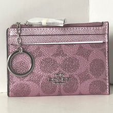 Load image into Gallery viewer, Pink Coach wallet with keychain on a light gray background