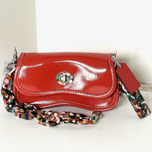 Load image into Gallery viewer, Red handbag with a colorful chain strap on a white background