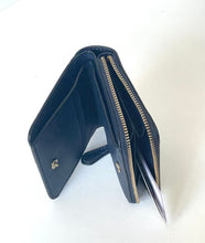 Load image into Gallery viewer, A dark navy blue leather wallet shown open, displaying its interior compartments, card slots, and gold-tone zippers, set against a plain white background.