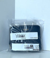 Load image into Gallery viewer, A Coach wallet in navy blue, still sealed in its clear plastic retail packaging with two white product labels attached, set against a plain light gray background.