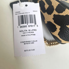 Load image into Gallery viewer, Leopard print shoe with a price tag showing details and barcode.
