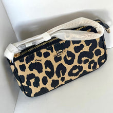 Load image into Gallery viewer, Leopard print pouch with white interior on a light gray background
