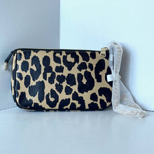 Load image into Gallery viewer, Leopard print pouch with a white strap on a light blue background