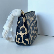 Load image into Gallery viewer, Leopard print handbag with a white strap on a light gray background