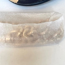 Load image into Gallery viewer, Gold ring with a heart-shaped stone in clear plastic packaging on a white surface.