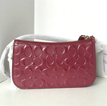 Load image into Gallery viewer, Pink handbag with white strap on a light gray background